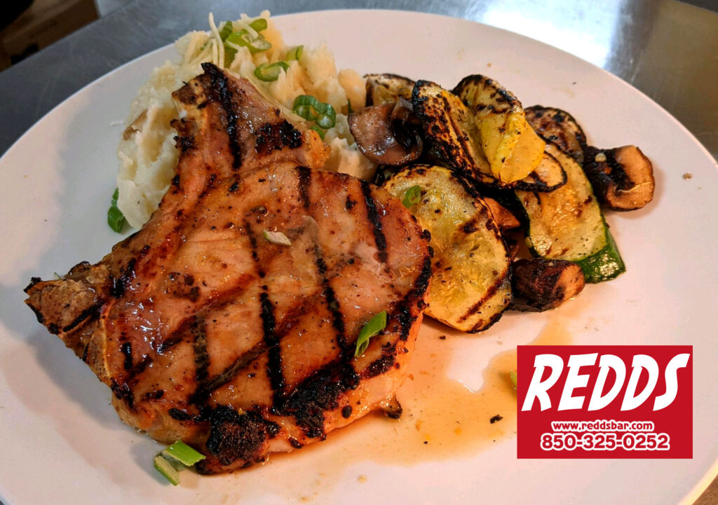 Pork Chop with Mashed Potatoes and grilled Zucchini and Mushrooms **This week's Special !! #yum #30adining #restaurant #30a #30aeats Redd's Pub